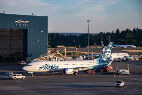 Alaskan Airline 737 in front of Alaskan Airlines hanger in Seattle Washington