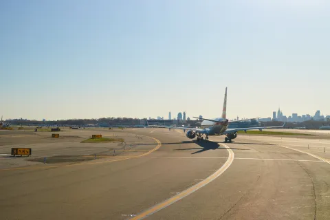 airplane at LaGuardia Airport. LaGuardia Airport is an international airport located in the northern part of Queens, New York City.