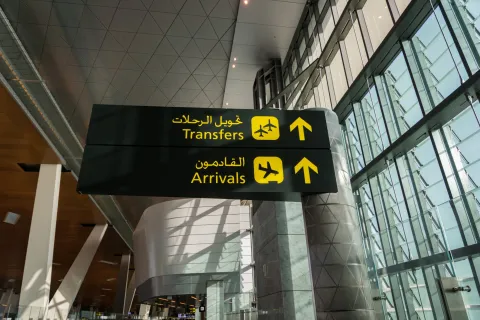 Doha, Qatar - June 2017 : airport transfer / arrival sign at Doha Hamad International Airport, Qatar.