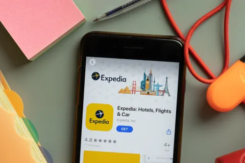  Expedia Hotels Flights and Cars mobile app logo on phone screen close up