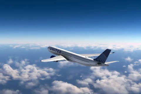 AirBus A330 United Airlines flying over the clouds