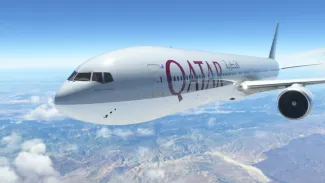 Boeing 777-300R Qatar Airways flying over the blue and clean sky, 10 Aug, 2022, Chicago, USA