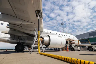 Refueling of airplane at airport. Ground service before flight