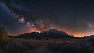 A stunning night sky reveals the Milky Way above the majestic mountains in Colorado at dusk