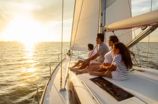 Family travel adventures on luxury yacht at sunset