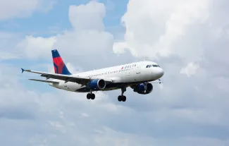 MIAMI, USA - September 11, 2016: A Delta Air Lines A320 aircraft landing at the Miami International Airport.