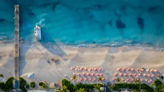 The activity of Grace Bay Turks and Caicos at sunset, as the tour boat delivers its passengers home