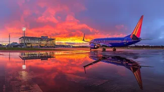 Southwest Airlines 737 at Sunset with Airport Reflection