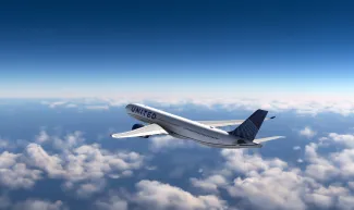 AirBus A330 United Airlines flying over the clouds