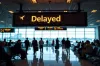 delayed flight announcement at airport gate