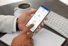 Person booking flight on smartphone airline application