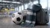 Football travel concept with soccer ball, suitcase, and winter fan scarf in an airport terminal background.