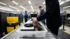 Person Places Personal Items in Security Bin at Airport Tsa Checkpoint for Screening