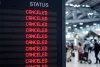 Airport flight information board showing multiple canceled flights