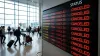 Digital airport flight information display board showing canceled status for multiple international airline departures