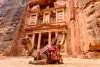 Spectacular view of two beautiful camels in front of Al Khazneh (The Treasury) in Petra.