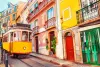 Yellow vintage tram on the street in Lisbon, Portugal. Famous travel destination