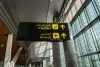 Doha, Qatar - June 2017 : airport transfer / arrival sign at Doha Hamad International Airport, Qatar.