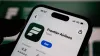 Closeup of a smartphone screen displaying the frontier airlines mobile app in the apple app store, showcasing the logo and download button