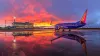 Southwest Airlines 737 at Sunset with Airport Reflection