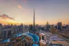 Aerial view of the Burj Khalifa and downtown Dubai skyline at sunset