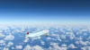 Commercial Boeing 777-200 Air Canada flying over the blue sky