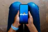 Allegiant Air logo is displayed on a smartphone screen.