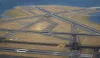 Aerial shot of Boston's Logan International Airport runways with planes taxiing.