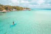 Girl doing paddleboard in Bacalar Lagoon, near Cancun in Riviera Maya, Mexico
